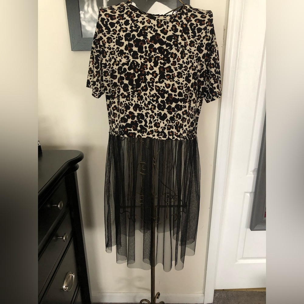 Short sleeve leopard print top with tulle bottom.